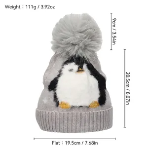 Grey penguin jacquard knit beanie with large faux fur pompom and ribbed cuff for winter