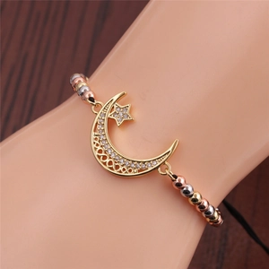 Adjustable tricolor beaded bracelet with gold star and moon charms with cubic zirconia