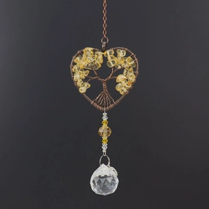 Detail of heart life tree suncatcher with yellow crystals and faceted glass ball
