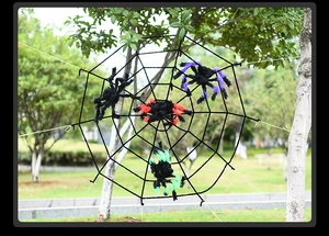 Outdoor Halloween giant spider web set with four colorful plush spiders on garden trees