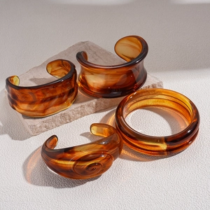 Vintage irregular geometric acrylic resin cuff bracelets in amber brown marble finish