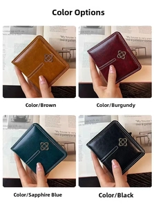 Short faux leather purses in brown, red, blue, and black with floral metal accents