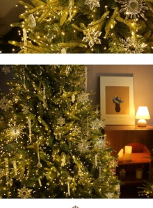 Close-up of warm LED string lights with acrylic snowflake and icicle ornaments for Christmas