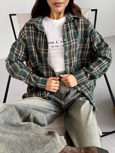 Detail of vintage plaid shirt with green and yellow pattern and chest pocket