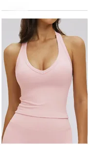Close-up of ceramic pink yoga vest featuring a halter V-neck design and soft elastic fabric