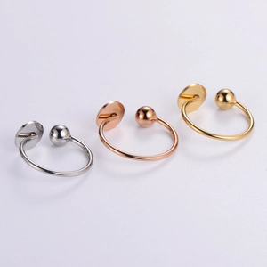 Polished stainless steel open rings in silver, gold, and rose gold with flat disc design