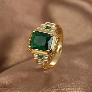 Vintage gold plated brass ring with emerald cut green zircon and crystal accents