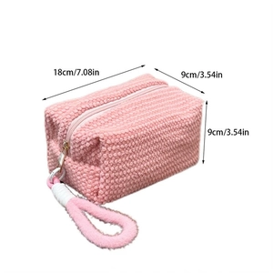 Pink plush cosmetics bag dimensions showing 18cm length and 9cm height on white background
