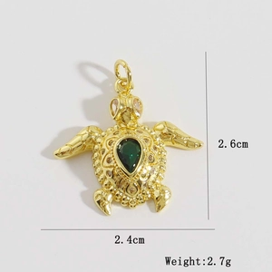 Macro view of 18K gold plated turtle pendant with green zircon, 2.6x2.4cm details
