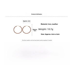 Detailed view of large brown leather wrapped hoop earrings with 6cm diameter and silver pins