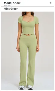 Front view of woman wearing a bean green yoga set with slim fit top and flared pants