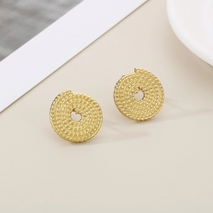 Detailed view of vintage twisted spiral hollow round stud earrings in 18K gold finish