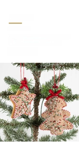 Detail of gingerbread-style non-woven felt Christmas star and tree ornaments with red bows