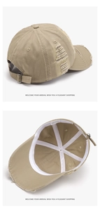 Detail view of khaki distressed cotton baseball cap with torn holes and metal buckle