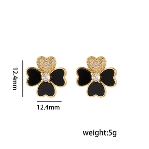 Elegant four-leaf clover stud earrings in black enamel and gold finish with zircon accents
