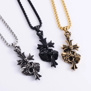 Detailed view of punk skull cross pendants in silver, gold, and black stainless steel finish