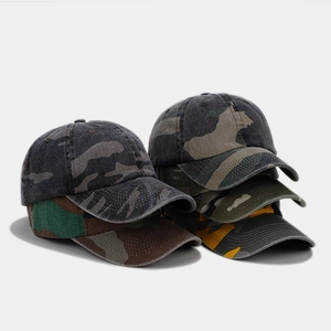 Detailed view of various camouflage baseball caps showing washed cotton texture and air vents