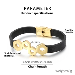 Detail of black cowhide leather bracelet with three interlocking gold stainless steel honeycombs