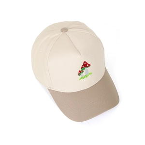 Close-up of mushroom embroidery on a two-tone cotton baseball cap with khaki brim