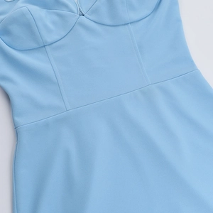 Detail of light blue strapless dress showing twill fabric texture and corset seam lines