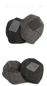 Detail view of newsboy caps in dark grey herringbone and brown tweed with patch