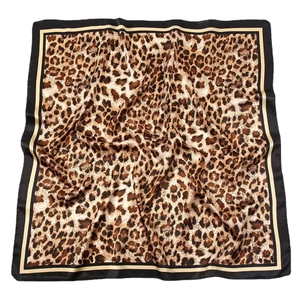 Square satin leopard print scarf with black border in a soft draped arrangement