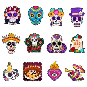 Detailed grid of 12 vibrant Day of the Dead spiral hanging decorations on white background
