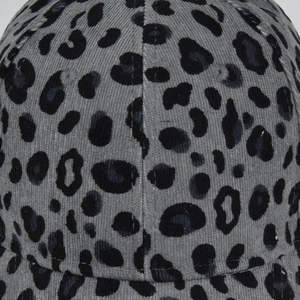 Close-up of grey leopard print baseball cap showing corduroy texture and pattern detail