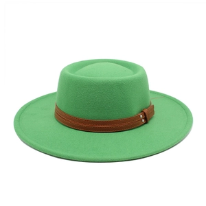 Detail of green wool felt fedora featuring brown leather strap and silver stud accents
