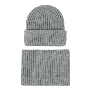 Detail of light grey ribbed knit hat and scarf set featuring vertical texture and soft wool