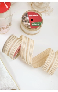 Detail of champagne and gold striped velvet Christmas ribbon for gift wrapping