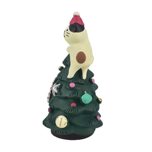 Miniature resin Christmas tree figurine with a cat wearing a red festive hat