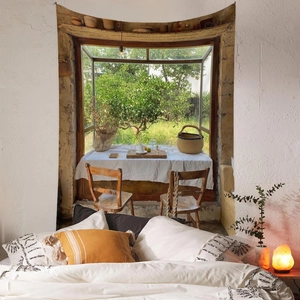 Detailed view of bohemian wall tapestry featuring realistic vintage garden window scenery