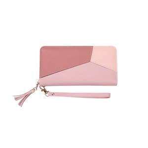 Pink patchwork long wallet with geometric design, zipper closure and wristlet strap
