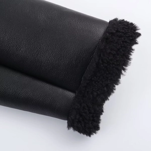 Women's black fleece-lined biker jacket with stand collar and faux leather texture