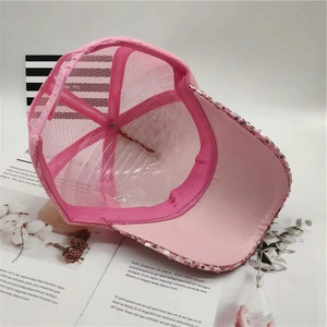 Detail of pink sequin mesh baseball cap showing inner structure and breathable material
