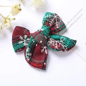 Barrette nœud de Noël en tissu à carreaux rouge et vert avec motifs de flocons