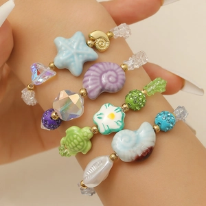 Colorful beaded bracelet set with starfish and shell charms for beach summer style