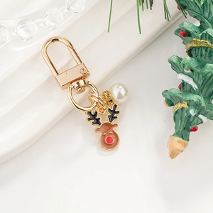 Christmas reindeer keychain with gold metal lobster clasp, white pearl and festive charm