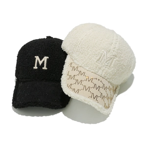 Winter faux fur baseball cap with M letter embroidery in black and cream white colors