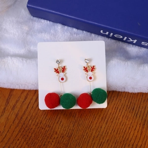 Asymmetric Christmas earrings with white reindeer, rhinestones and festive color pom poms