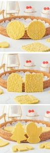 Detailed close-up of Christmas cookies embossed with various festive holiday patterns