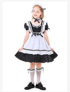 Detailed view of child black and white maid costume with apron, headband and lace stockings