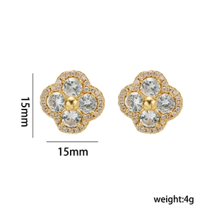Golden clover stud earrings with zircon stones and size dimensions in a 15mm width