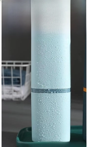 Close-up of a light blue portable toothbrush travel case with frosted waterproof texture