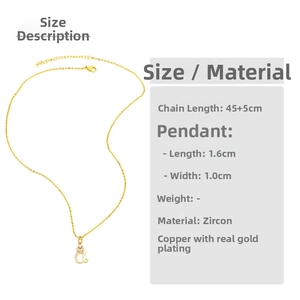 Close-up of lowercase letter a pendant in gold finish with white zircon inlay detailing