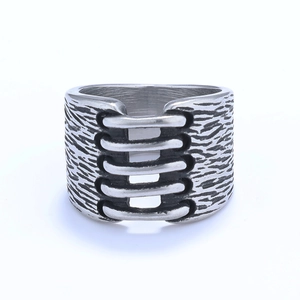 Vintage industrial style wide stainless steel ring with rustic texture and tiered cutouts
