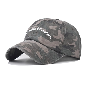 Washed camo baseball cap with Adventure & Freedom embroidery on a clean white background