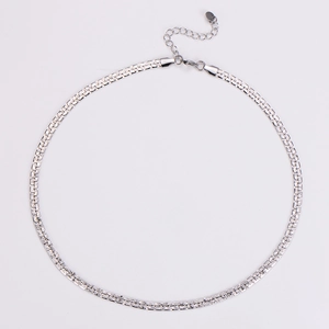 Detailed top view of a minimalist silver metal chain with lobster clasp and extension
