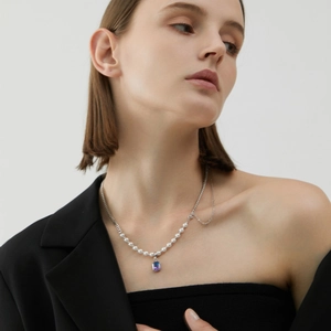 S925 silver necklace with white pearls and asymmetric chain featuring purple gemstone